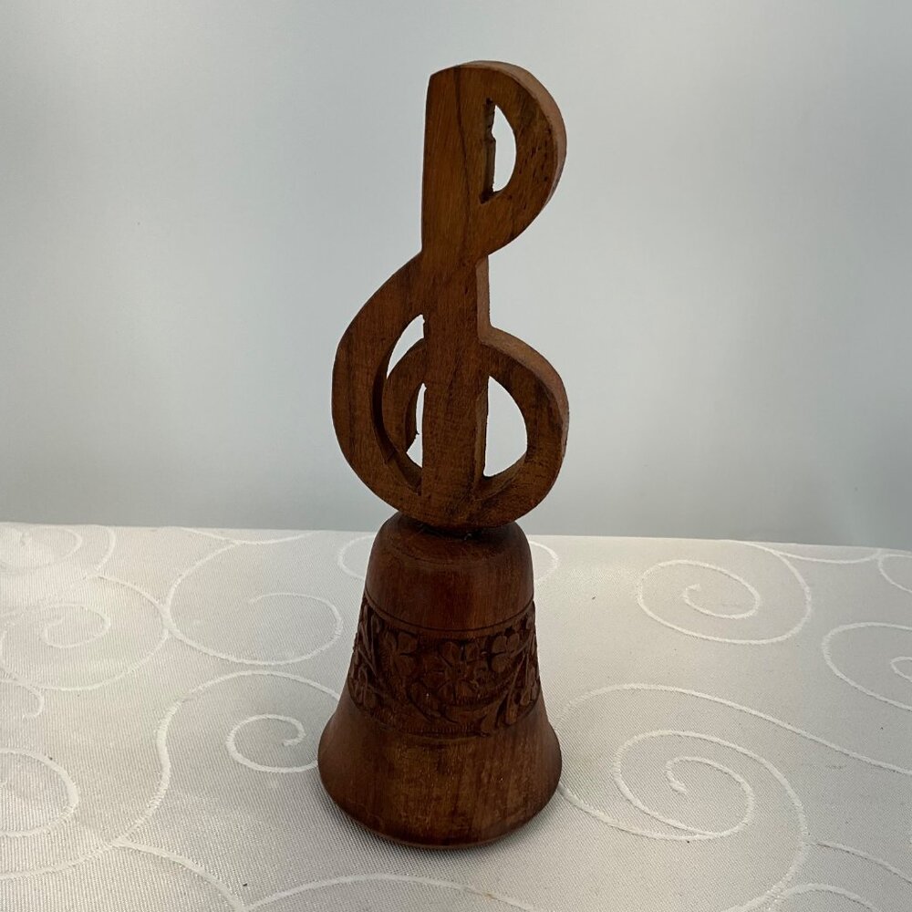 Hand-Carved Wooden Bell With Treble Clef Design